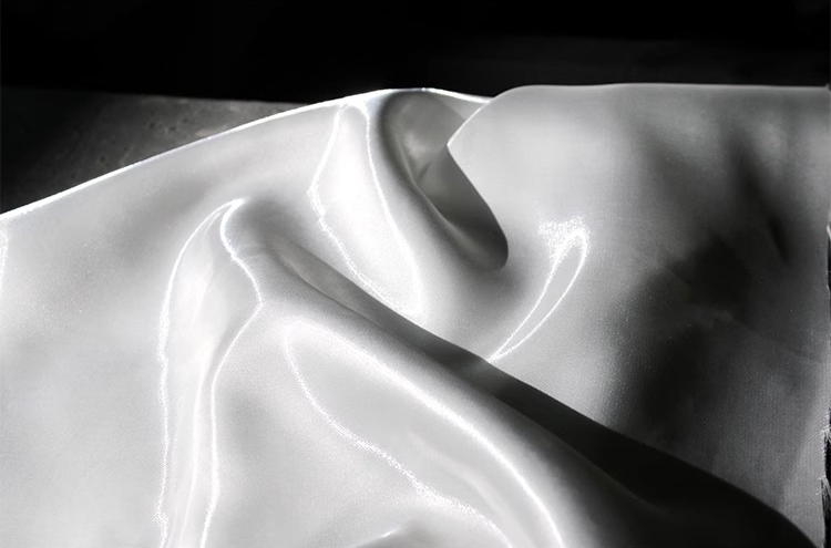 Lustre Flow Fabric – High-Gloss Reflective Textile